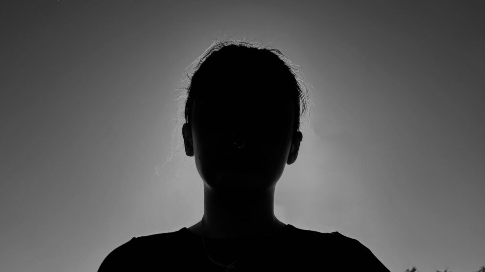 Black and White Photo of Woman in Silhouette